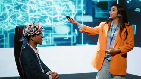 presenter at ai convention showing eeh headset demonstration