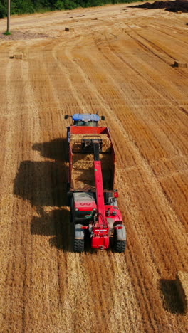 aerial view of farm tractor harvesting hay