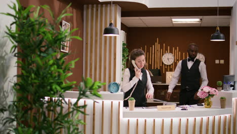 Hotel-staff-answers-calls-at-reception