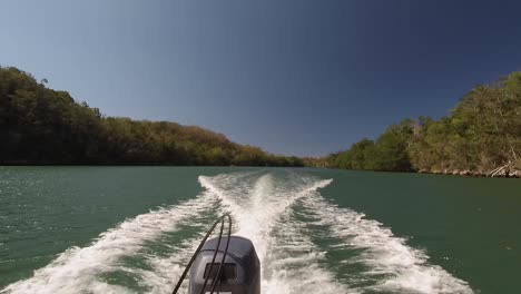 view of a boat engine speeding down the river matanzas, cuba