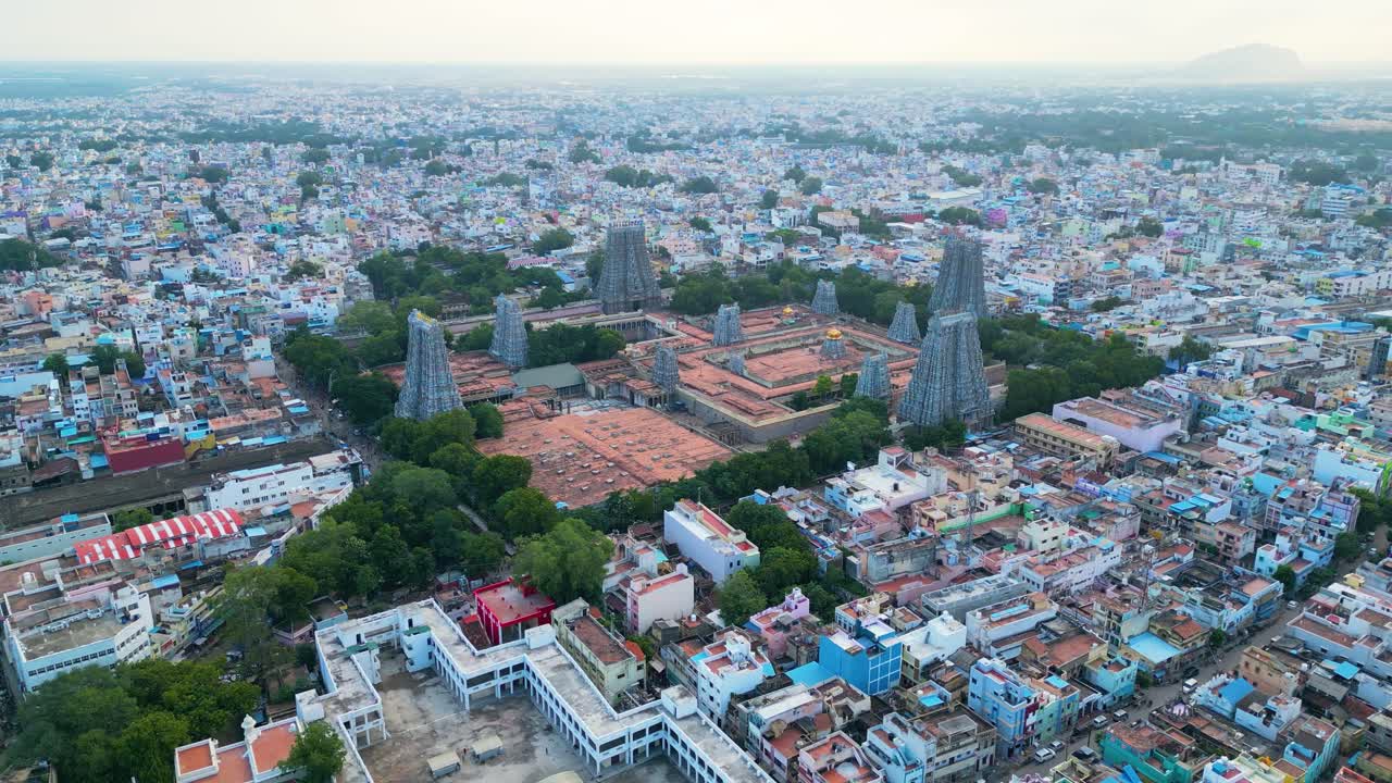 Aerial orbit around Meenakshi Amman Hindu Temple towers in Ancient city of Madurai