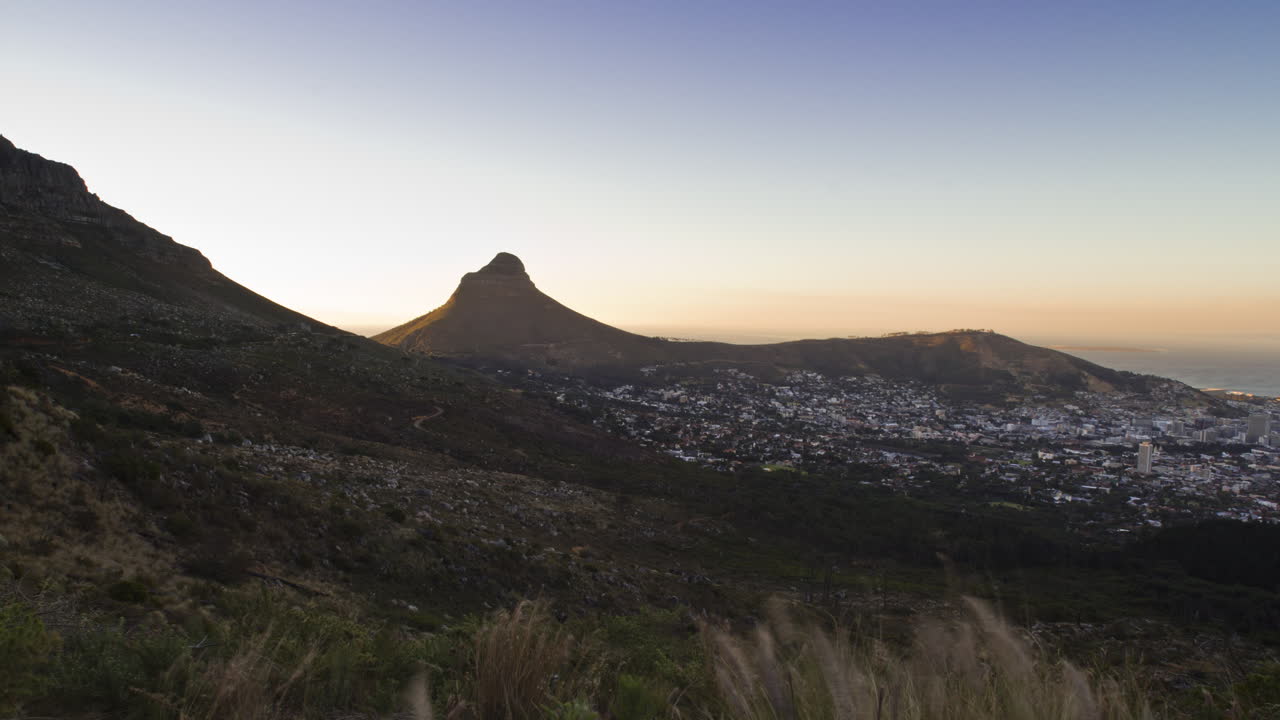 Motion Timelapse of the sun setting over the City of Cape Town, as viewed from Tafelberg Road on Table Mountain