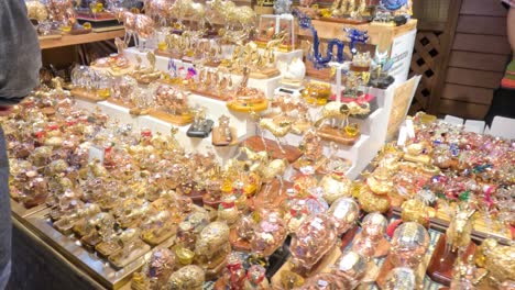 handmade gold-leaf glass figurines at a market