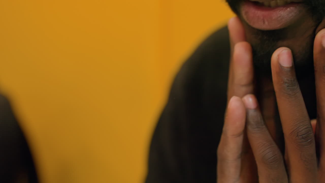 Nervous male cues. Man displaying subtle anxious signals. Closeup of man showing slight signs of stress. Individual demonstrating nervous behaviors through gentle facial touches and lip movements
