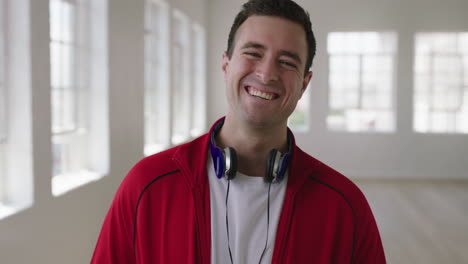 close-up-portrait-of-attractive-young-caucasian-man-laughing-cheerful-enjoying-new-apartment-lifestyle-change