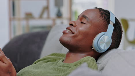 Black-man,-phone-and-headset-listening-to-music