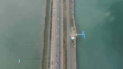 a breakwater road that separates the sea