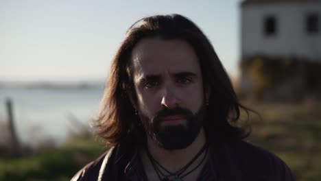 portrait of a man with long hair and beard