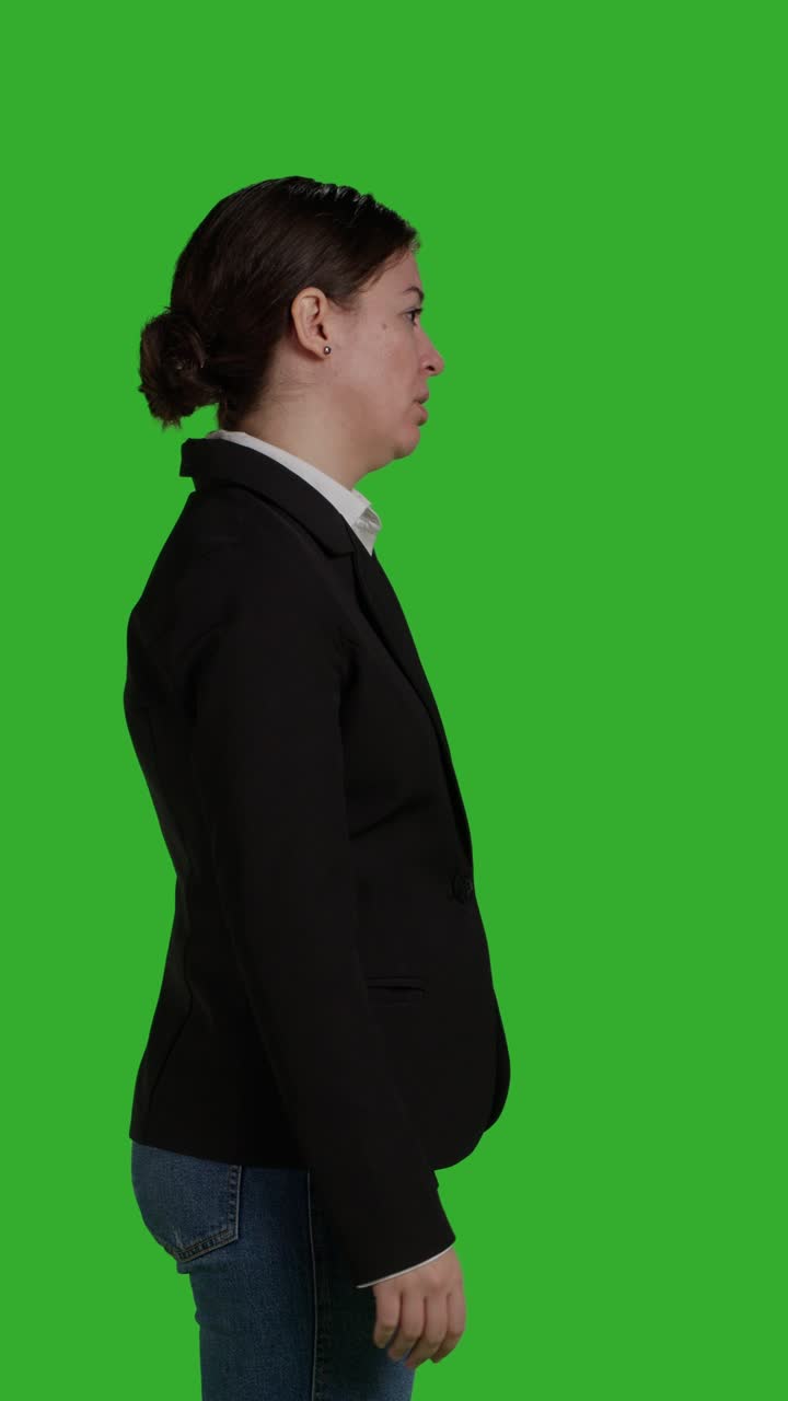 Vertical video: Profile of young angry businesswoman acting negative