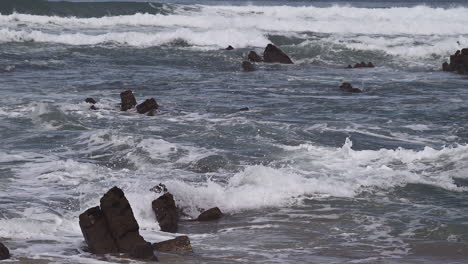 breaking waves on rocks at the north atlantic coast of portugal in slowmotion