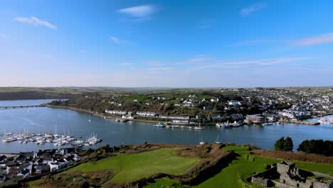 wide aerial panorama over river bandon, james fort, town of kinsale and marina with green fields on a sunny day