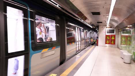 train arrives and passengers board at naples station