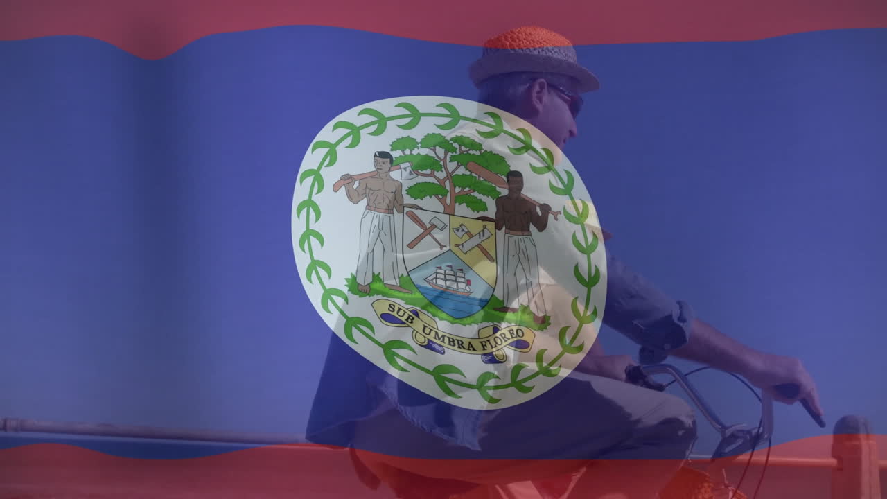 Riding bicycle with Belize flag animation overlay against clear blue sky
