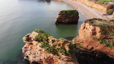 Aerial-View-Flying-Overhead-Of-Sea-Stacks-At-Ladram-Bay