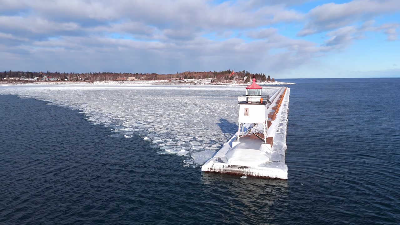 Light house in Two Harbors Minnesota during a winter cold day in Lake Superior with ice formations 2