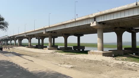 newly built bridge yet to paint near shore of a sea in patna, bihar, india.
