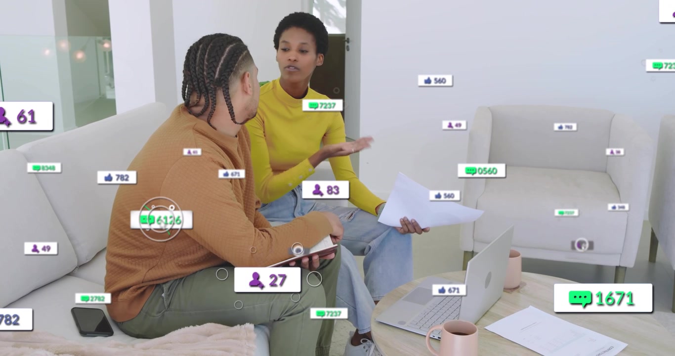 Female presenting report and explaining stats while male taking notes with rising engagement icons