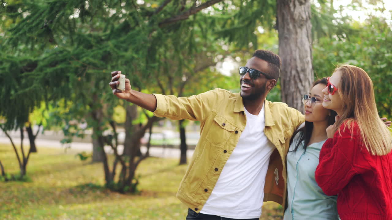 Friends Taking a Selfie in Autumn Park