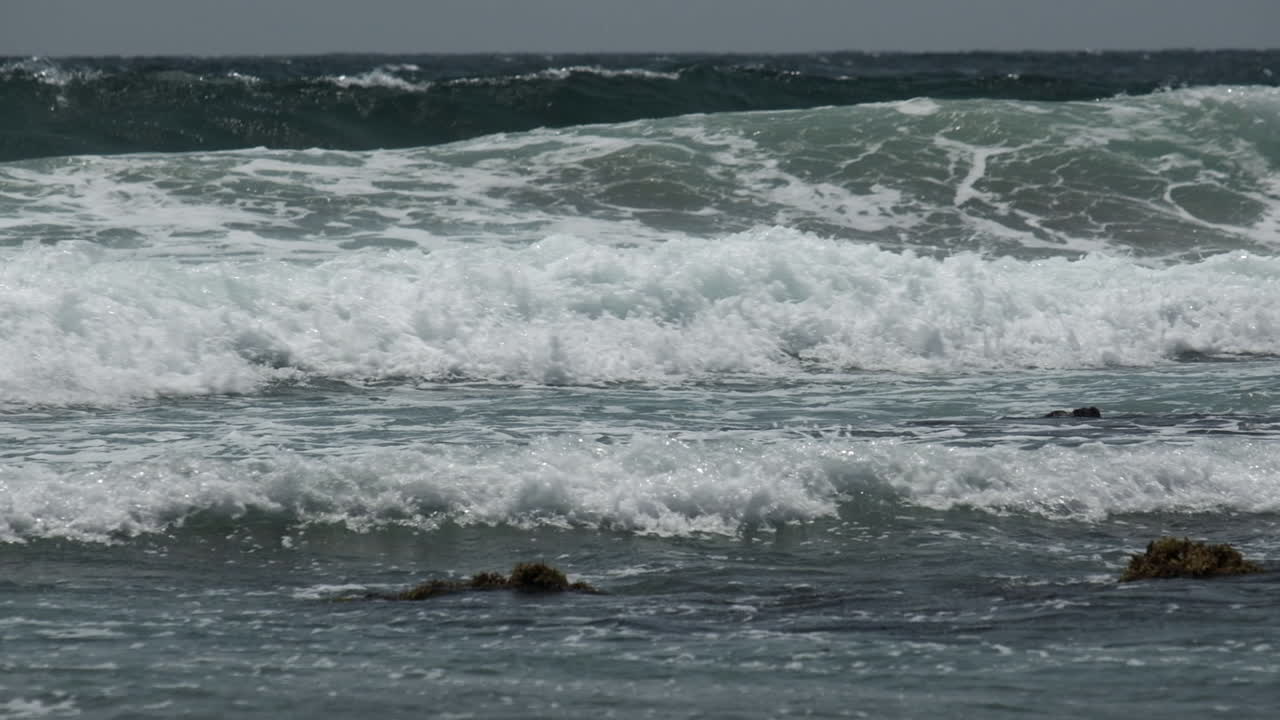 Incoming tidal waves off the south coast of Cornwall, England.