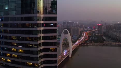 guangzhou liede bridge with heavy evening traffic on a beautiful colorful sunset