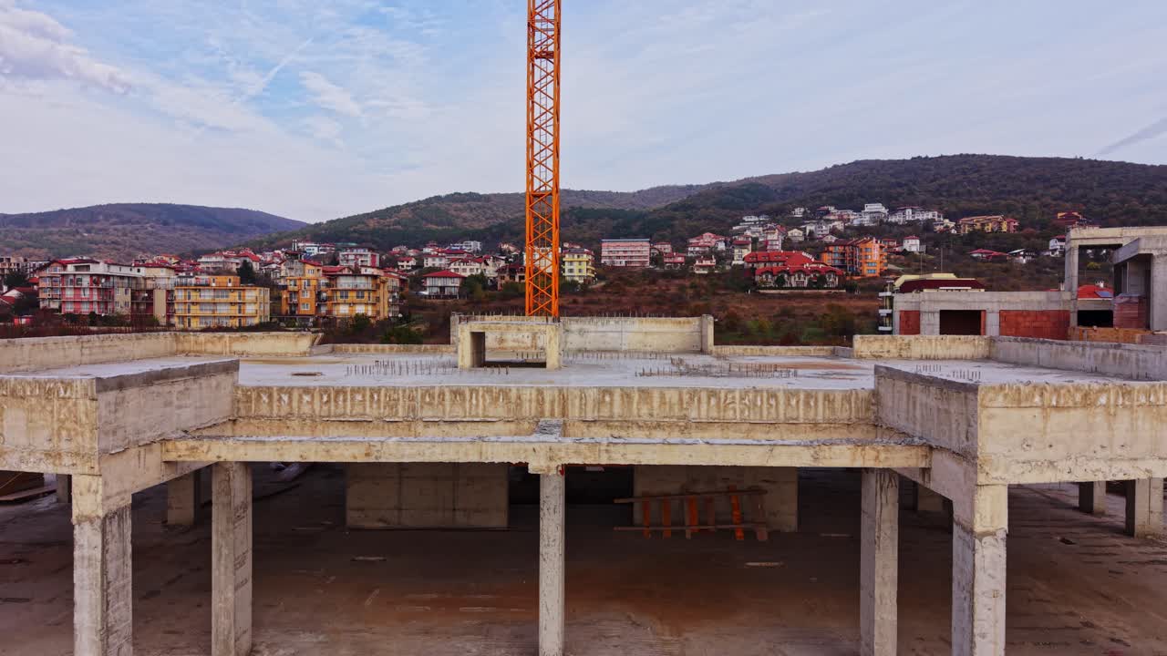 Construction progresses on a large building at a development site