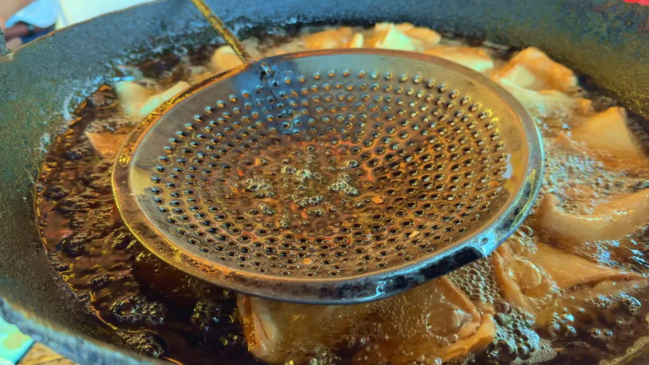 closeup of samosa making at indian food stall
