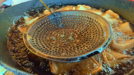 closeup of samosa making at indian food stall