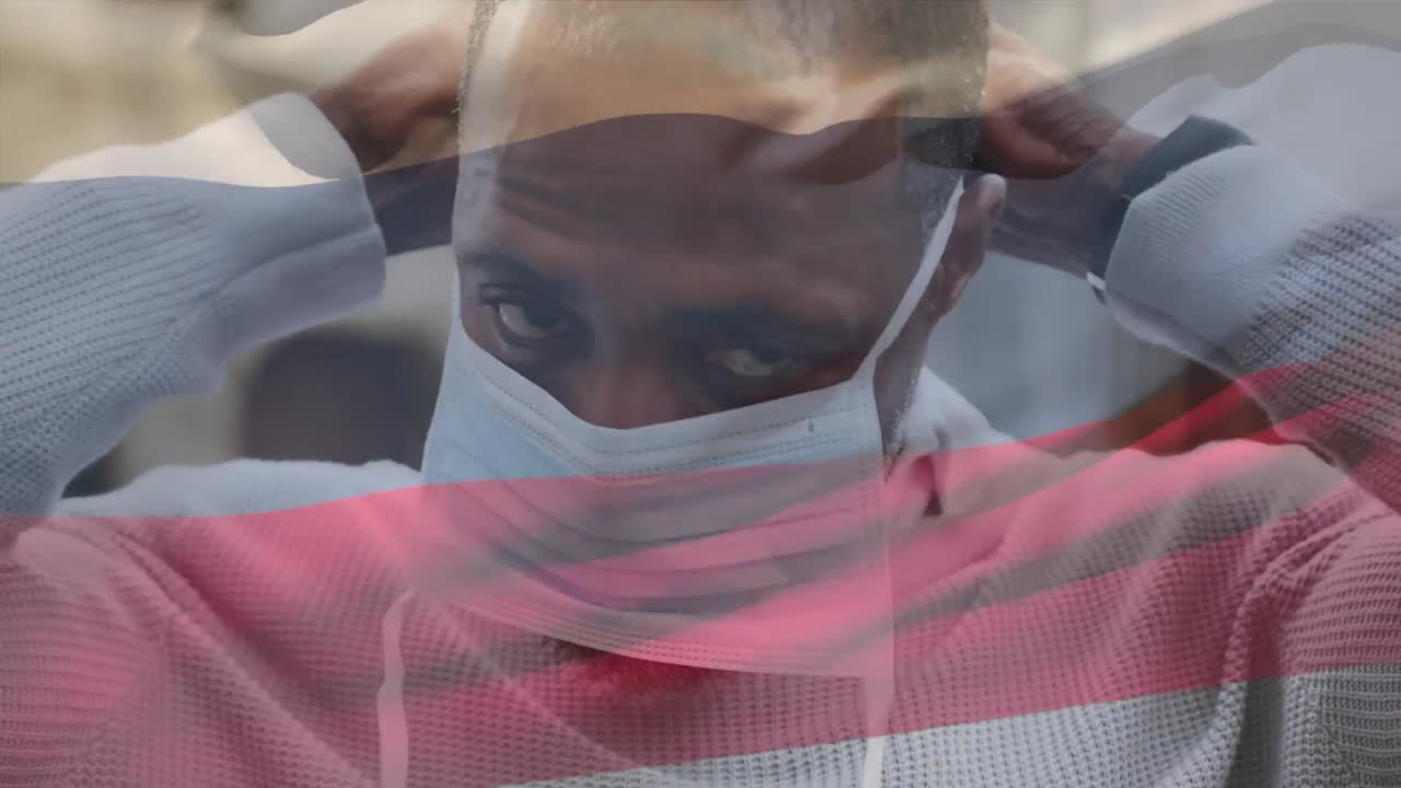 animación de la bandera de rusia ondeando sobre un hombre que usa una máscara facial durante la pandemia de covid-19