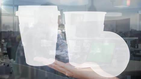 Animation-of-digital-screen-with-white-cups-over-caucasian-senior-man-with-laptop-and-cityscape