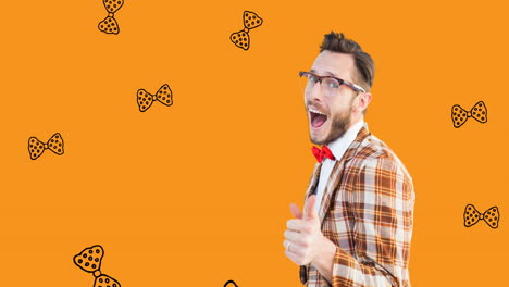 animation of happy caucasian man over orange background with falling bow ties