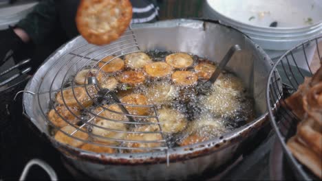 close shot of street food being deep fried ready for sale