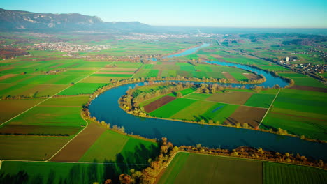 winding aare river through rural green fields near grenchen, solothurn, switzerland