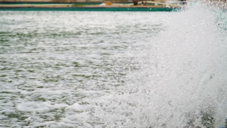 Zoom-out-of-spinning-wheels-of-aerator-turbines-in-shrimp-farm