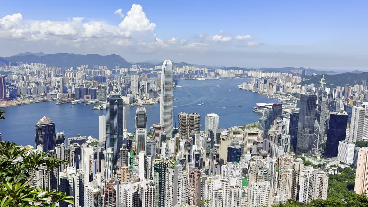 Footage of Hong Kong city skyline and sea as seen from Victoria Peak, showcasing panoramic views of skyscrapers, Victoria Harbour, and coastal scenery, highlighting iconic travel and urban landscapes