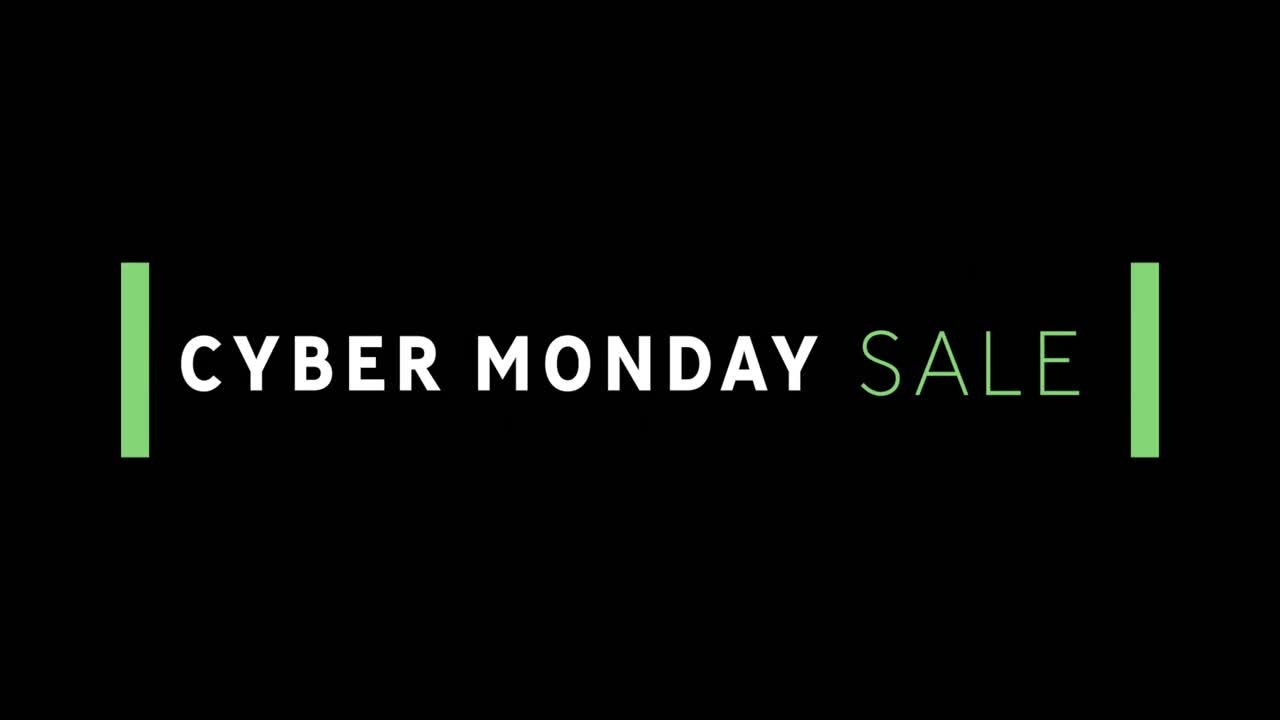 texto de venta blanco y verde de cyber monday que aparece contra una pantalla negra