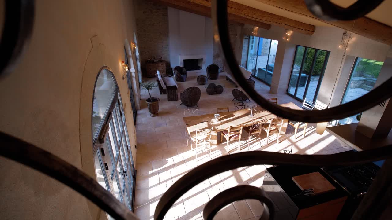 Exploration shot through a decorative metal bannister looking