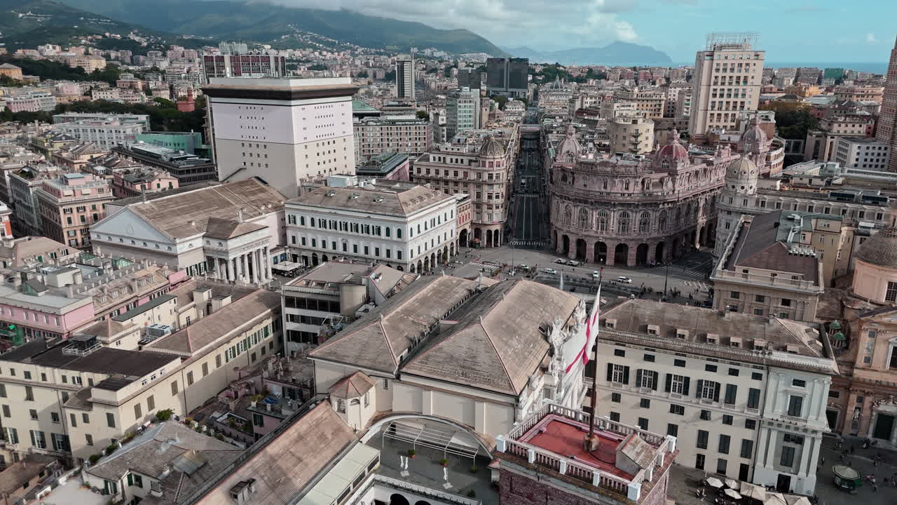 Rooftop aerial view of St Georges Cross flag and Piazza Ferrari in Genoa
