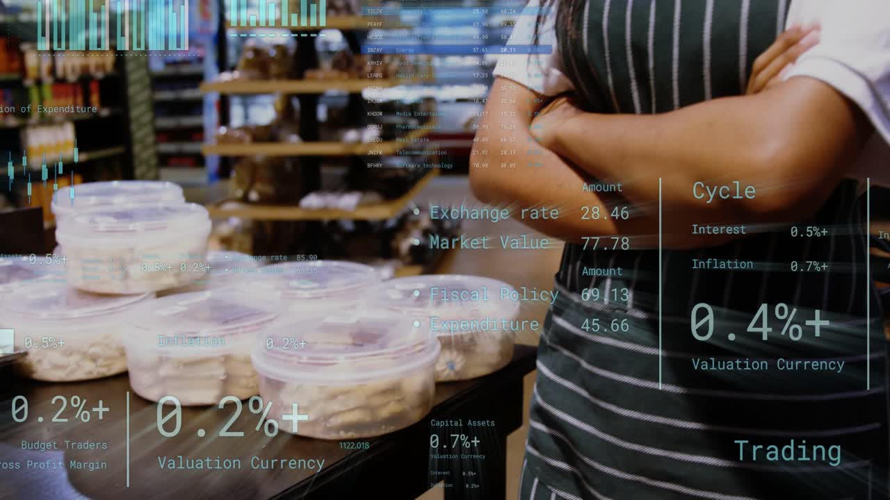 Bakery staff standing beside display camera pulling back revealing sales charts over pastries