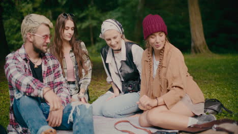 Friends-Having-Fun-During-Picnic-At-Park