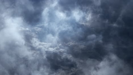 a dark stormy sky with dark clouds and lightning