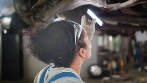 Woman-inspecting-automobile