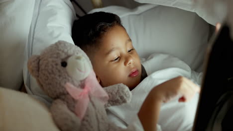 night, bed and a child with a tablet for internet