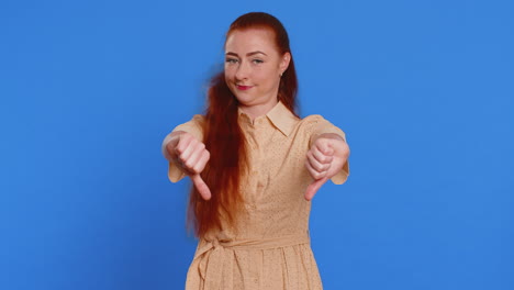 upset attractive young woman girl showing thumbs down sign gesture disapproval dissatisfied dislike