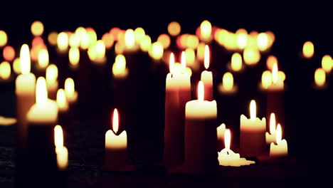 many candles glowing in the dark