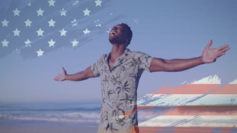 Animation-of-american-flag-over-african-american-man-raising-hands-at-beach