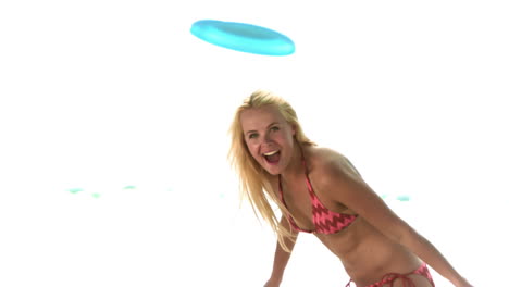 blonde playing frisbee in slow motion