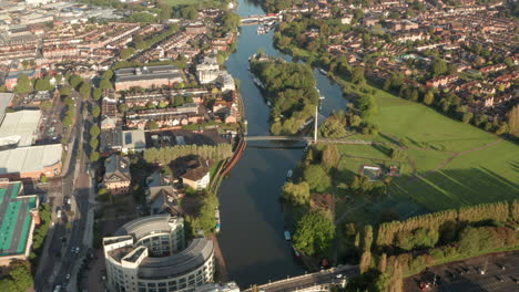 Aerial-shot-over-the-river-Thames-passing-through-Reading-town