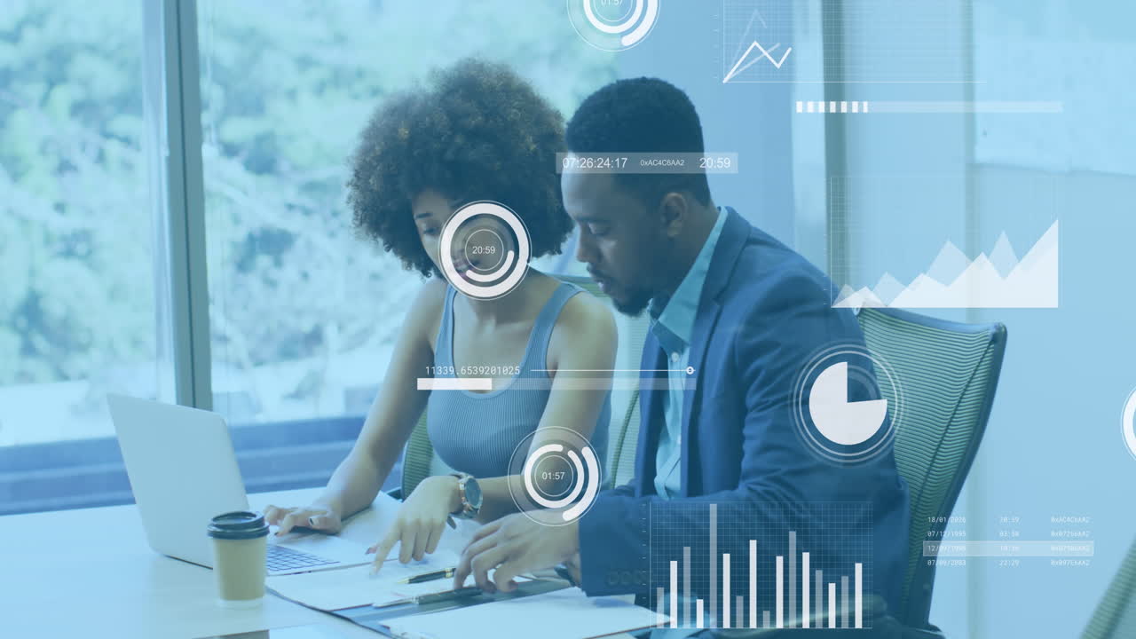 Animation of statistical data processing against african american man and woman discussing at office