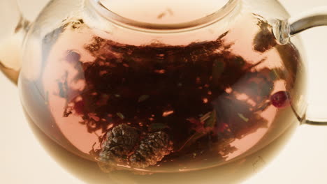 glass teapot with herbal tea infusion