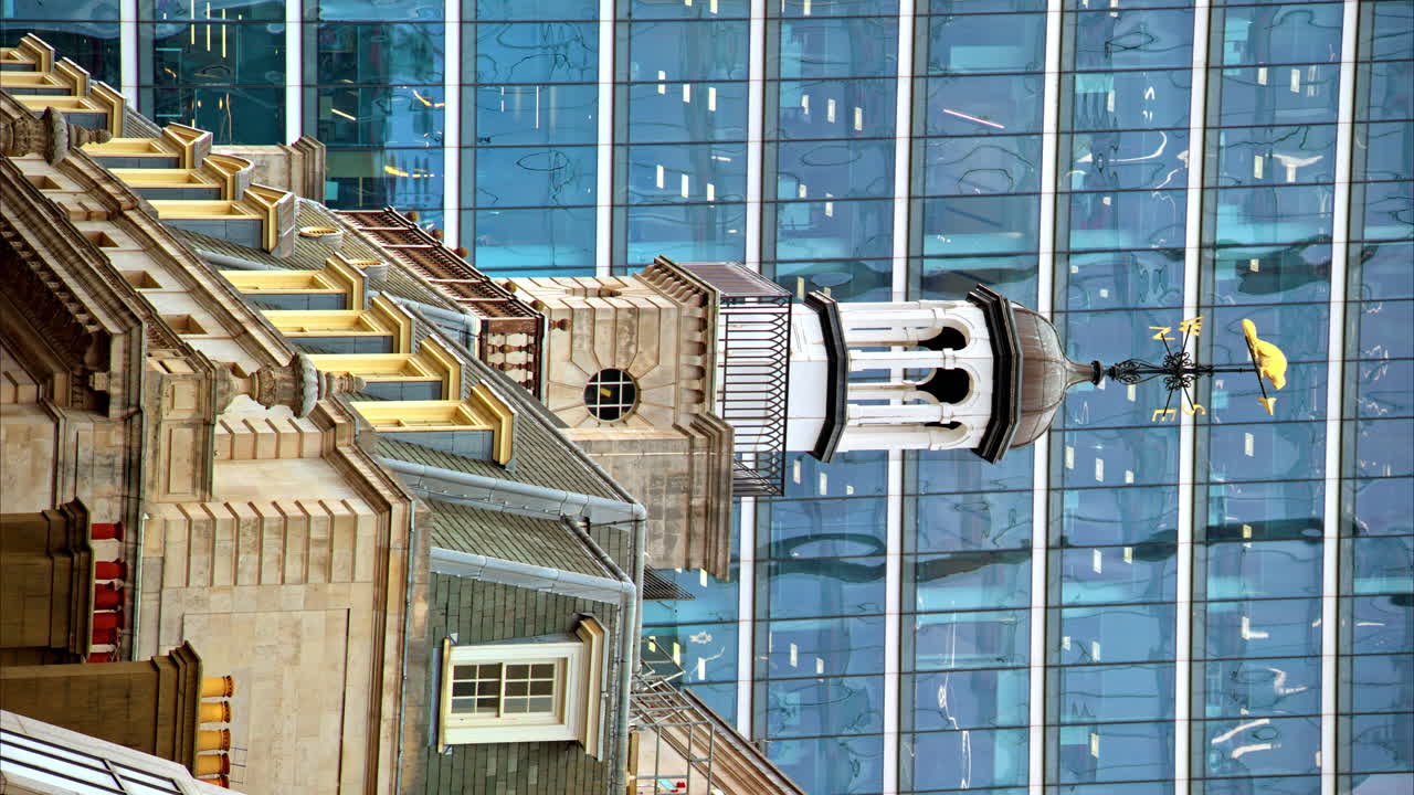 Vertical view of a classic building with modern skyscraper on the background in London City district in downtown, United Kingdom